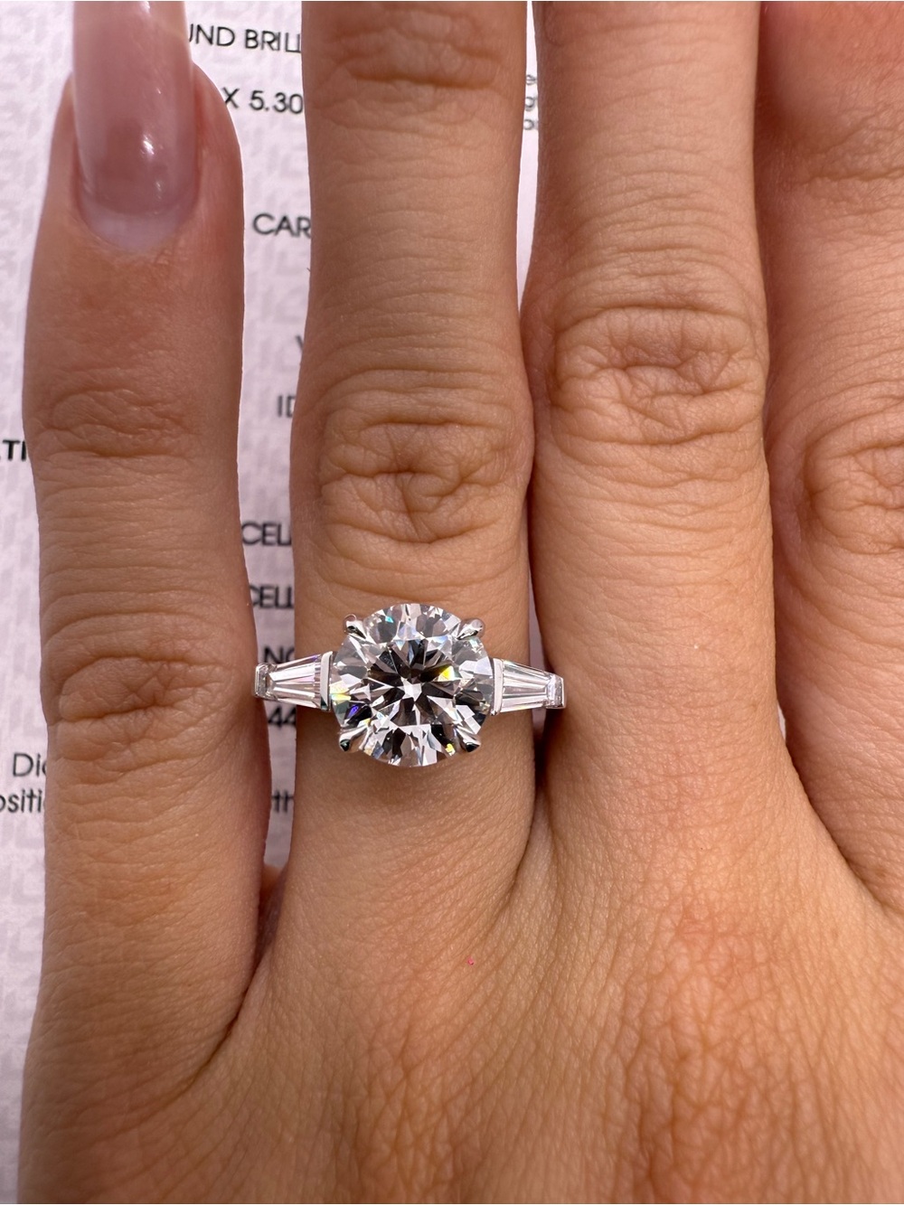 2.50 carat E VS1 round lab diamond with tapered baguettes three stone engagement